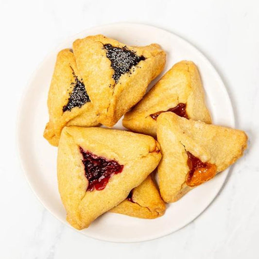 Our buttery, flaky Hamantaschen filled with a variety of luscious fillings including Prune, Apricot, Cherry, and Poppyseed.