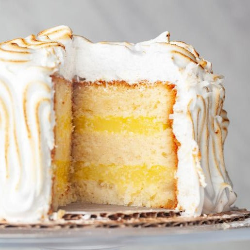 Lemon Meringue Cake slice with citrus curd and torched meringue topping – William Greenberg Desserts NYC