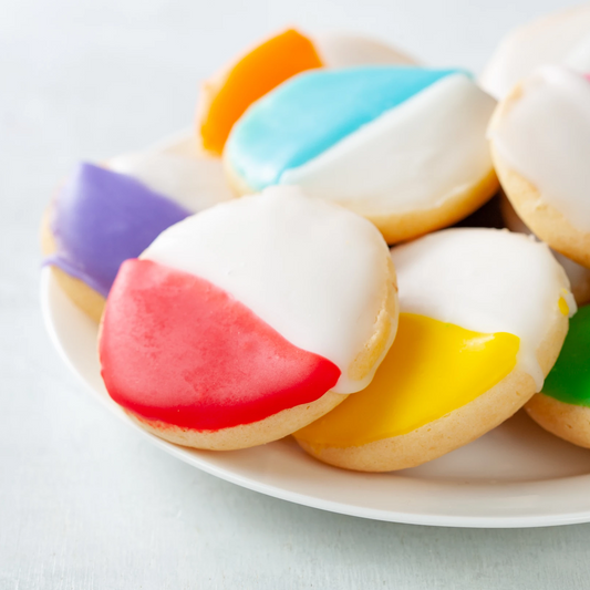 William Greenberg custom shortbread cookies in rainbow colors on a plate.