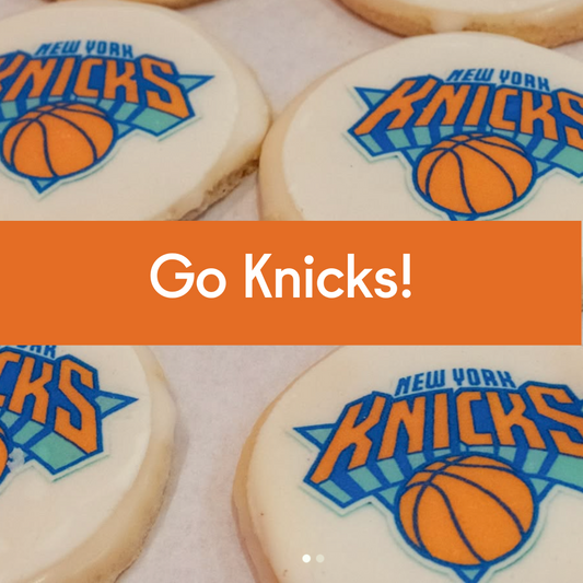 Limited-edition Knicks-themed shortbread cookies on a baking tray with a Go Knicks! Banner