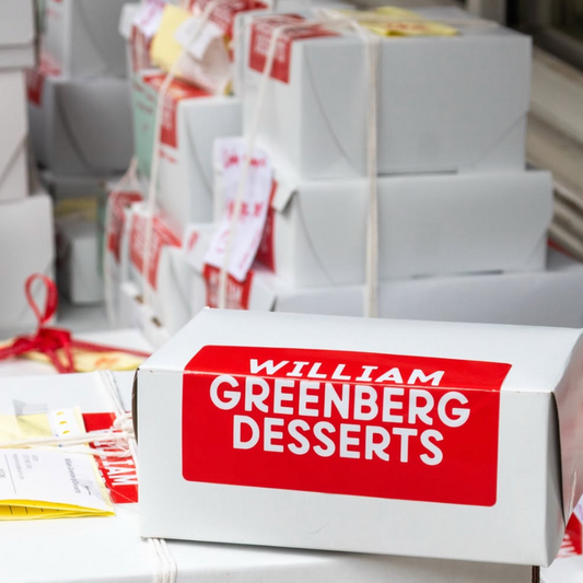 boxes of william greenberg desserts waiting to be sent
