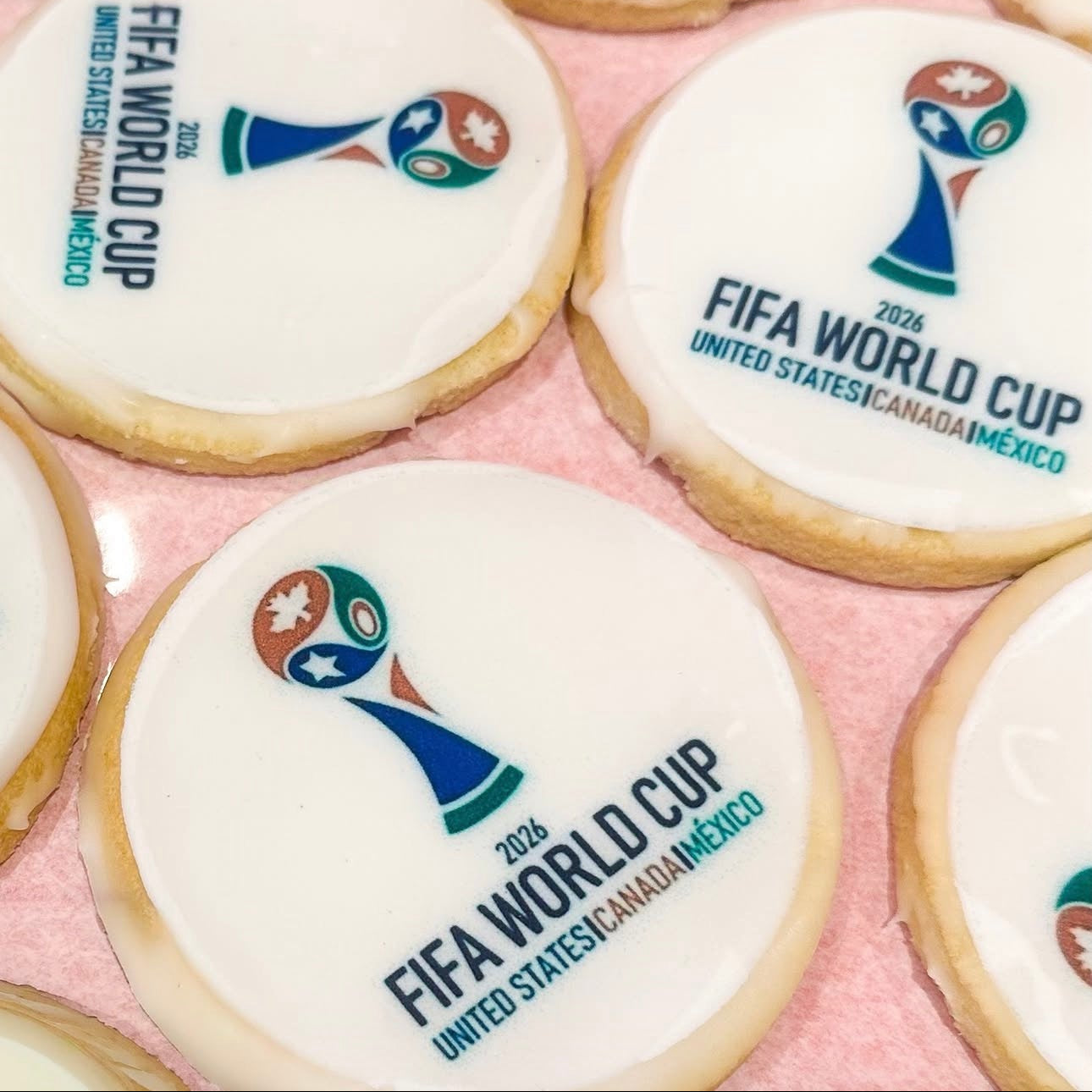 Cookies with FIFA World Cup 2022 logo on a pink background