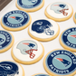 Cookies with New England Patriots logo and helmet design on a white surface