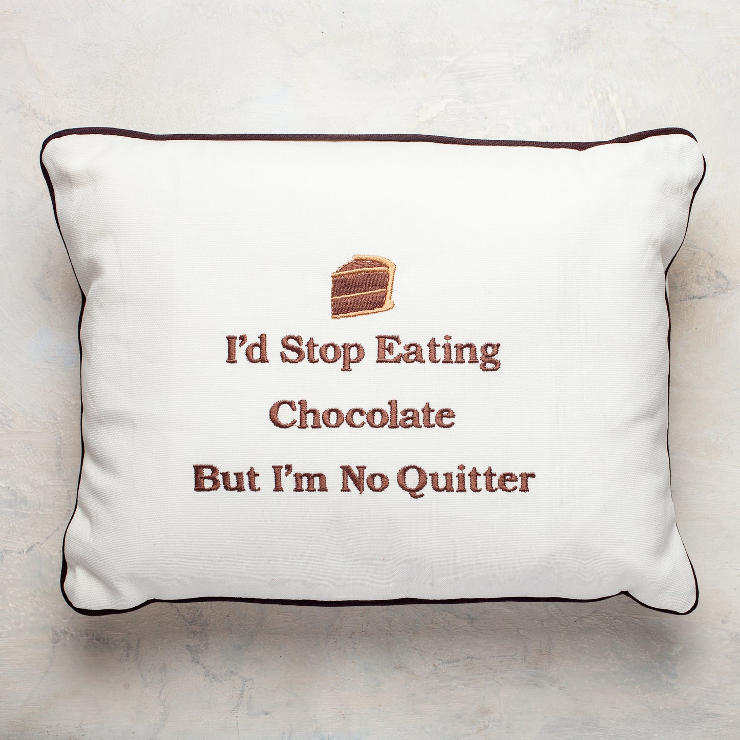 "I'd stop eating chocolate but I'm no quitter " embroidered pillow from William Greenberg Desserts