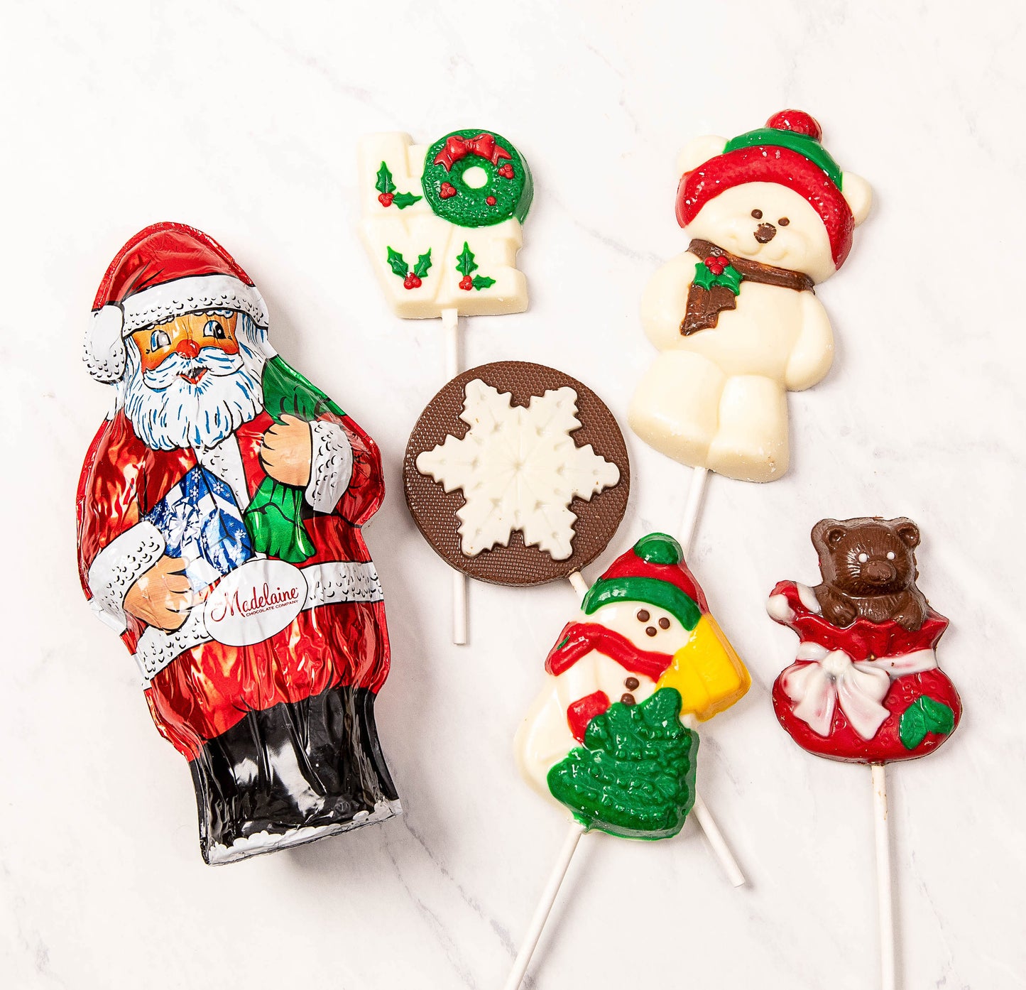 6 different chocolate christmas treats on sticks